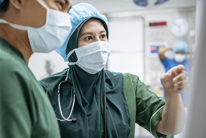 Closeup of ICU nurses discussing disaster response plans