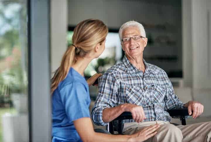 Shot of a senior man with Alzheimer's being assisted by his female nurse