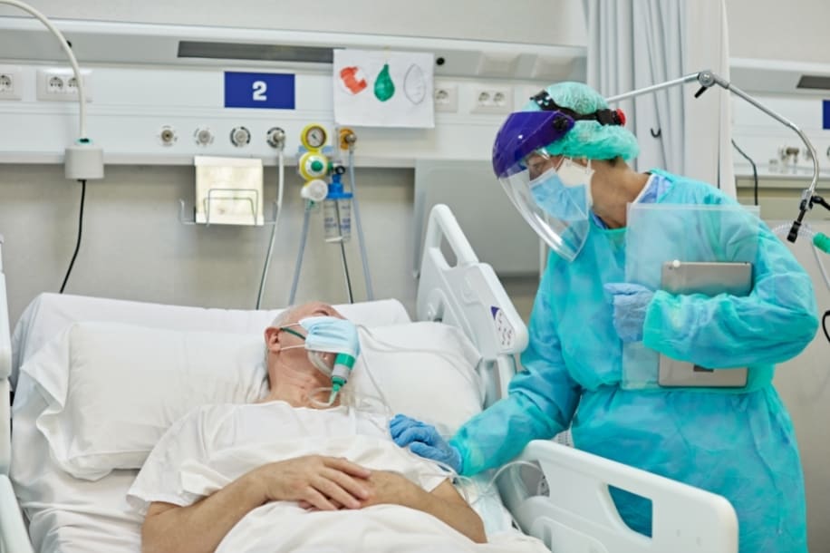 ICU nurse caring for COVID patient