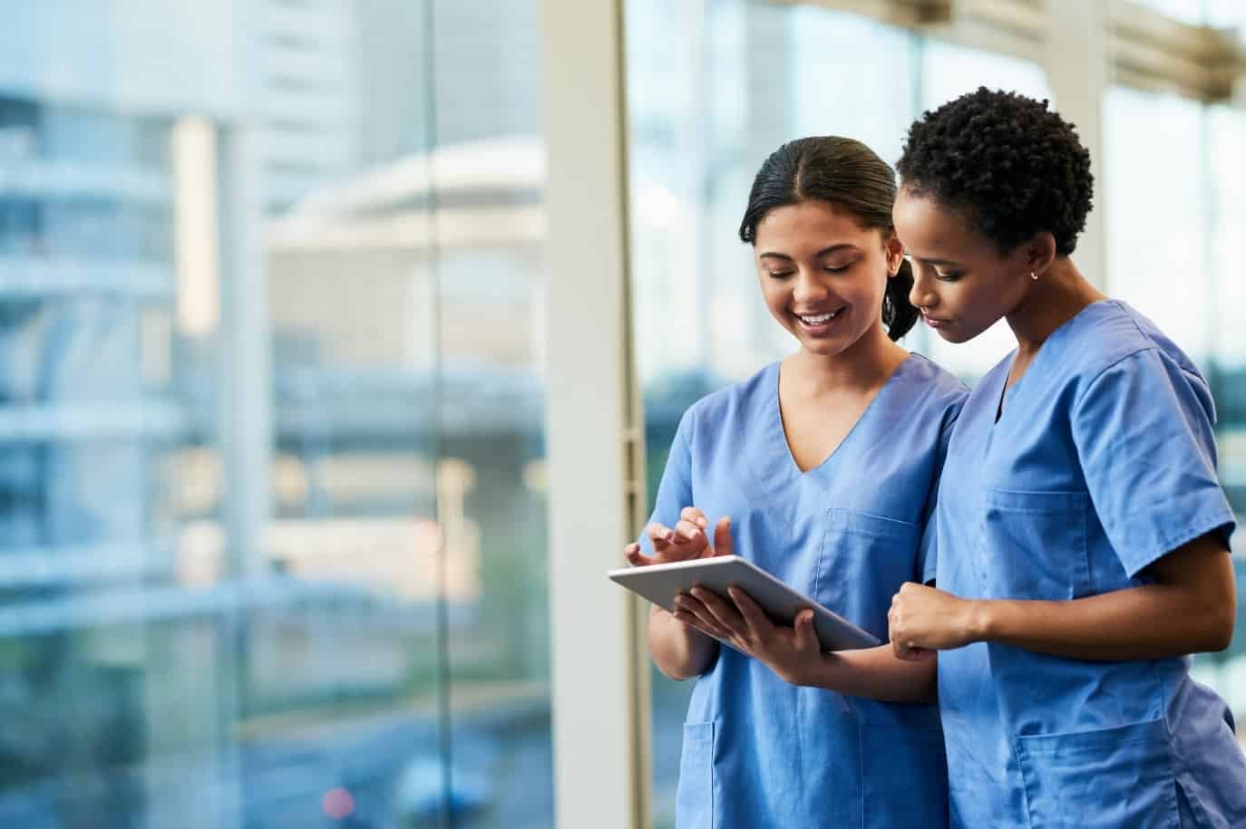 healthcare professionals use iPad to explore COVID-19 surge staffing tool